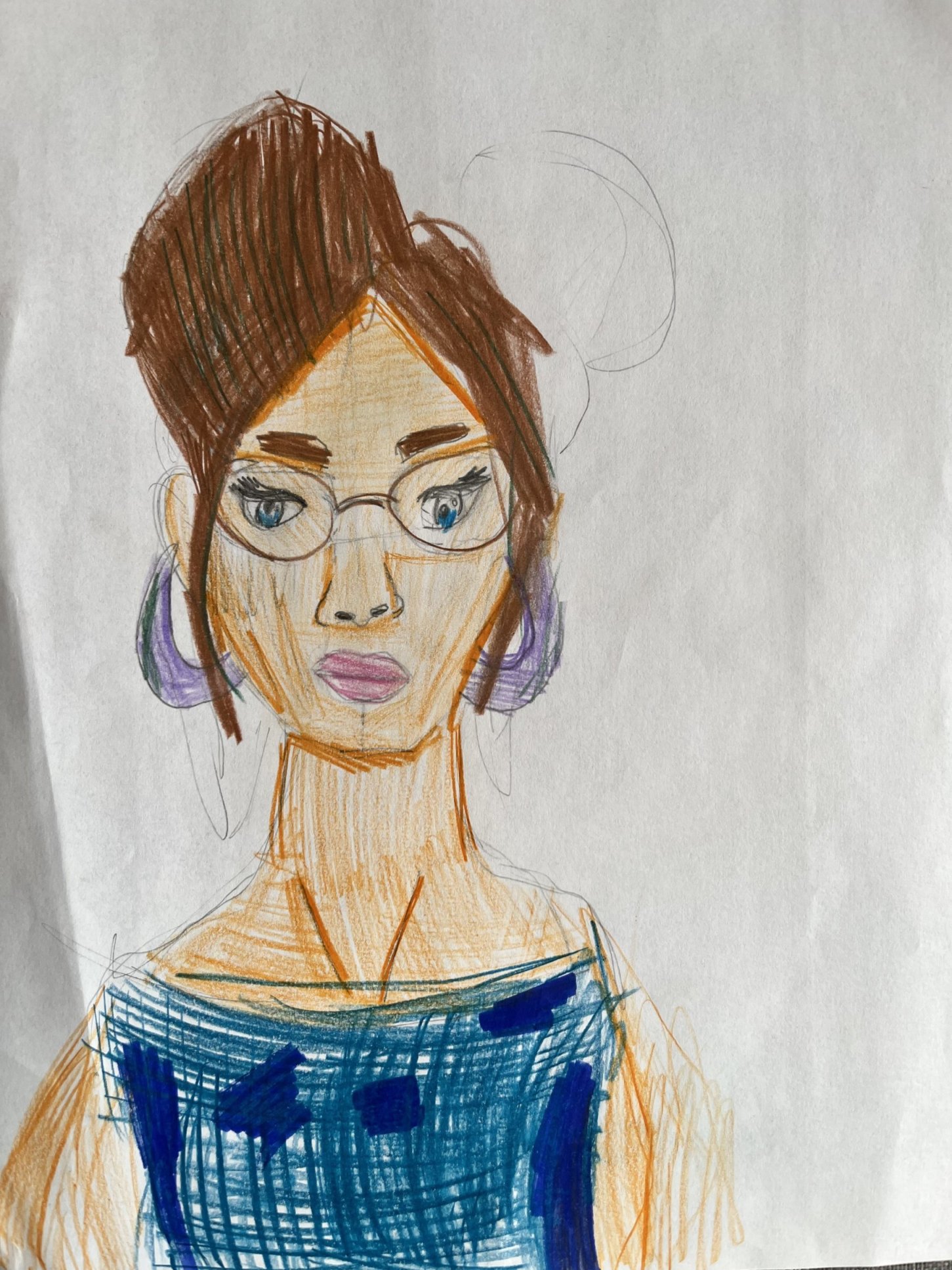 A lady with glasses in a bluedress and big purple ear-rings.